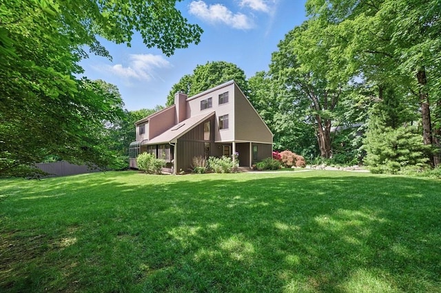 224 E St, Sharon, MA 02067 - rear view of property featuring a chimney
