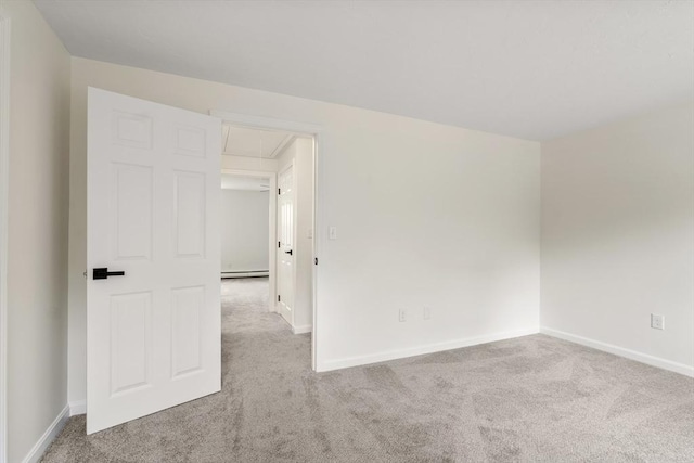 20 Washington St Unit 15, Easton, MA 02356 - spare room featuring carpet flooring, attic access, baseboard heating, and baseboards