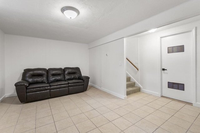 20 Washington St Unit 15, Easton, MA 02356 - living room featuring stairs, light tile patterned floors, and baseboards