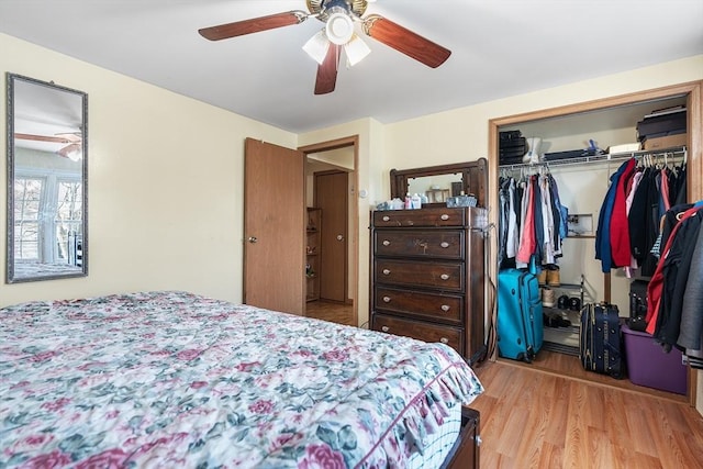 bedroom featuring ceiling fan, a closet, and light hardwood / wood-style flooring