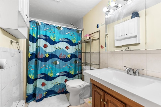 bathroom featuring tile walls, vanity, a shower with curtain, and toilet