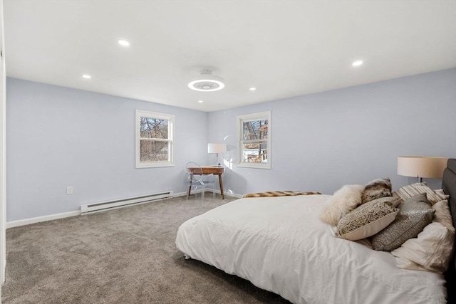 bedroom featuring carpet floors and a baseboard heating unit