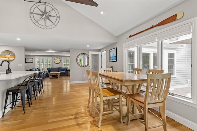 85 Mann Hill Rd, Scituate, MA 02066 - dining area with light wood finished floors, recessed lighting, and high vaulted ceiling