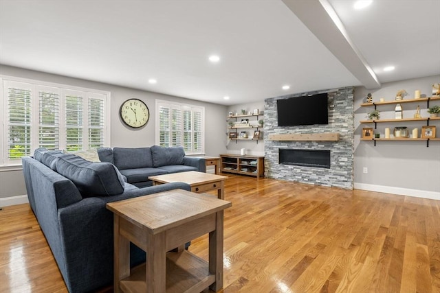 85 Mann Hill Rd, Scituate, MA 02066 - living room with a stone fireplace, light wood-style floors, and recessed lighting