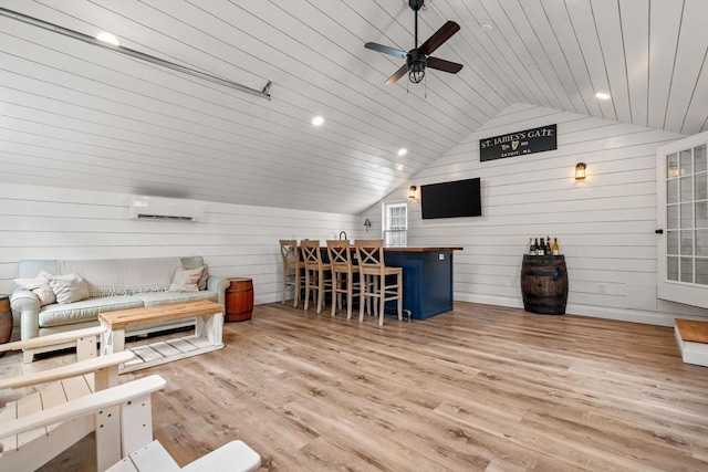 85 Mann Hill Rd, Scituate, MA 02066 - living room with vaulted ceiling, wood finished floors, ceiling fan, wooden walls, and an AC wall unit