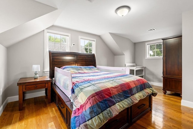 85 Mann Hill Rd, Scituate, MA 02066 - bedroom featuring lofted ceiling, light wood-style flooring, and multiple windows