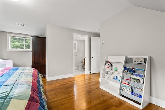 85 Mann Hill Rd, Scituate, MA 02066 - bedroom with light wood-style flooring, ensuite bathroom, and lofted ceiling