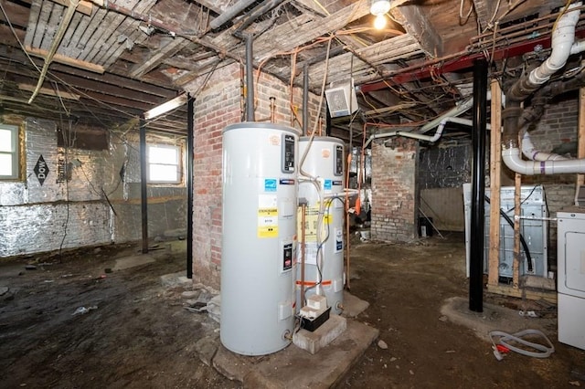 basement featuring electric water heater, gas water heater, and washer / clothes dryer
