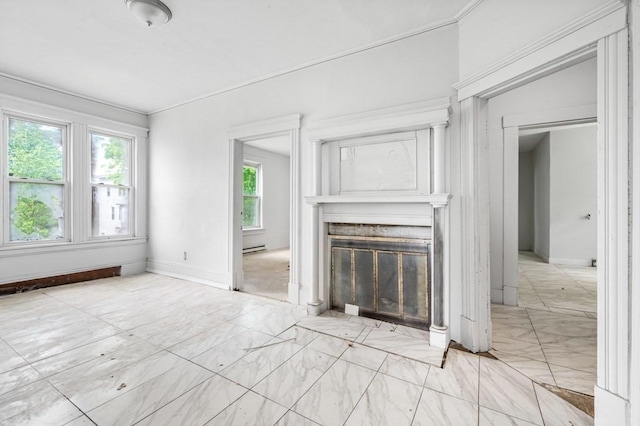 unfurnished living room with a glass covered fireplace, baseboard heating, marble finish floors, and baseboards