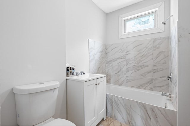bathroom featuring toilet, vanity, and shower / bath combination