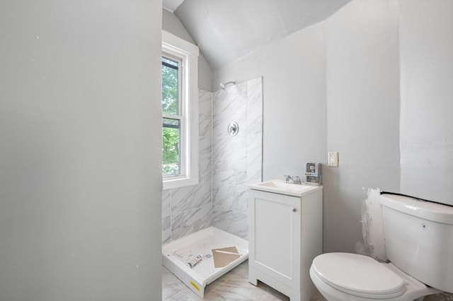 full bath featuring marble finish flooring, toilet, a shower stall, vaulted ceiling, and vanity