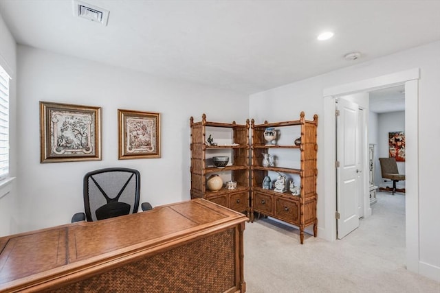 office space featuring visible vents and light colored carpet