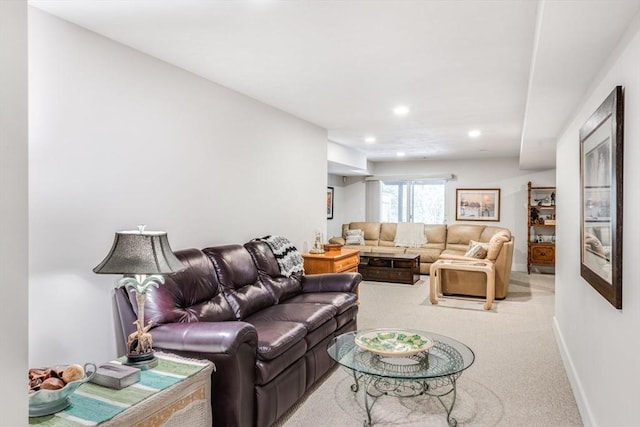 living area featuring light carpet, baseboards, and recessed lighting