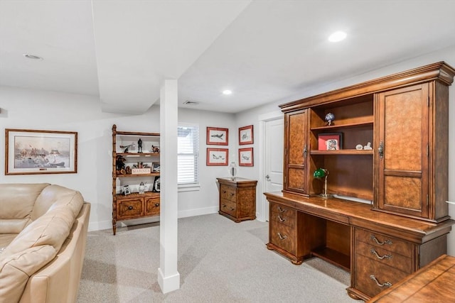 office area featuring recessed lighting, light carpet, baseboards, and built in study area