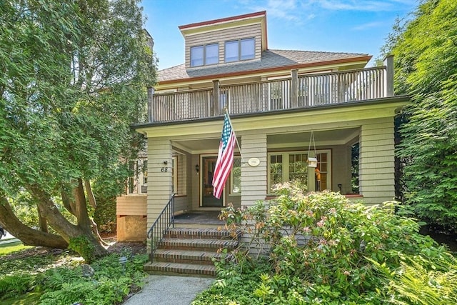 68 Barnard Ave, Watertown, MA 02472 - view of front facade featuring a balcony, covered porch, and a shingled roof