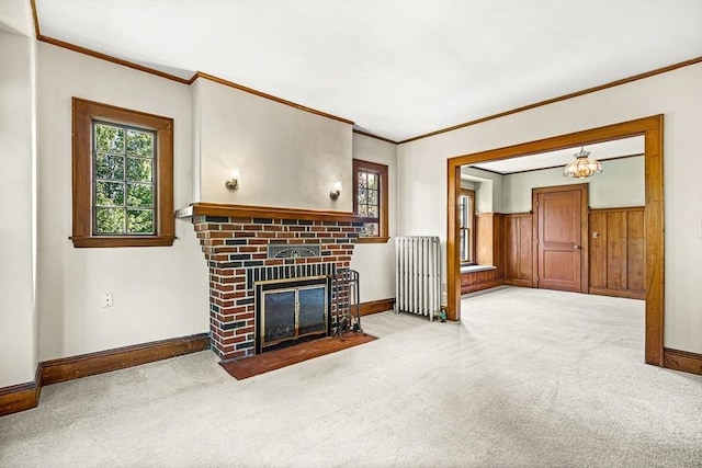 68 Barnard Ave, Watertown, MA 02472 - carpeted living area with radiator, crown molding, healthy amount of natural light, and a brick fireplace