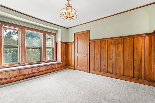68 Barnard Ave, Watertown, MA 02472 - carpeted empty room with wainscoting, wood walls, and crown molding