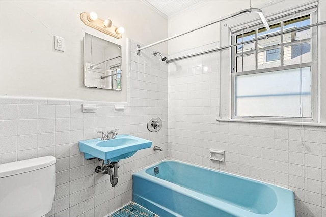 68 Barnard Ave, Watertown, MA 02472 - full bathroom featuring tile walls, shower / bath combination, and wainscoting