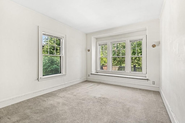 68 Barnard Ave, Watertown, MA 02472 - carpeted spare room featuring baseboards