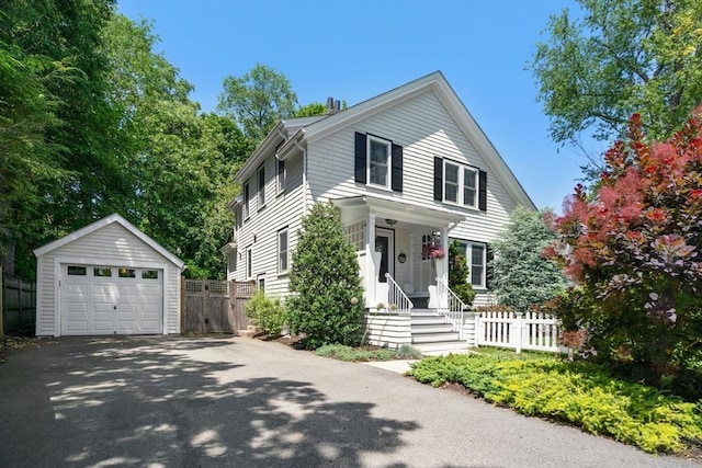 249 Blue Hills Pkwy, Milton, MA 02186 - view of front facade featuring an outdoor structure, asphalt driveway, and a garage