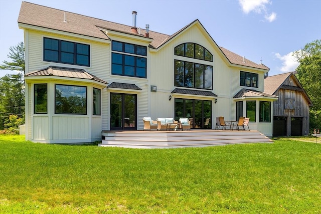 19 Hardscrabble Rd, Sterling, MA 01564 - back of property featuring a standing seam roof, a deck, a yard, and a metal roof
