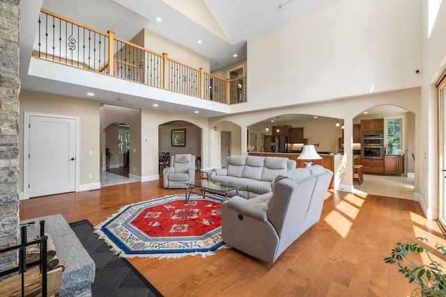 19 Hardscrabble Rd, Sterling, MA 01564 - living area with arched walkways, a high ceiling, light wood finished floors, and recessed lighting