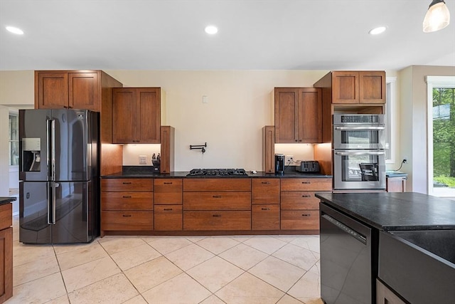 19 Hardscrabble Rd, Sterling, MA 01564 - kitchen with fridge with ice dispenser, dishwasher, double oven, gas stovetop, and brown cabinetry