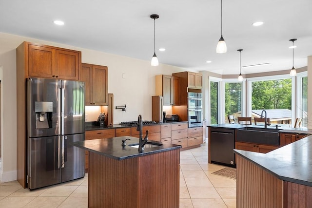 19 Hardscrabble Rd, Sterling, MA 01564 - kitchen with appliances with stainless steel finishes, an island with sink, dark countertops, light tile patterned floors, and recessed lighting