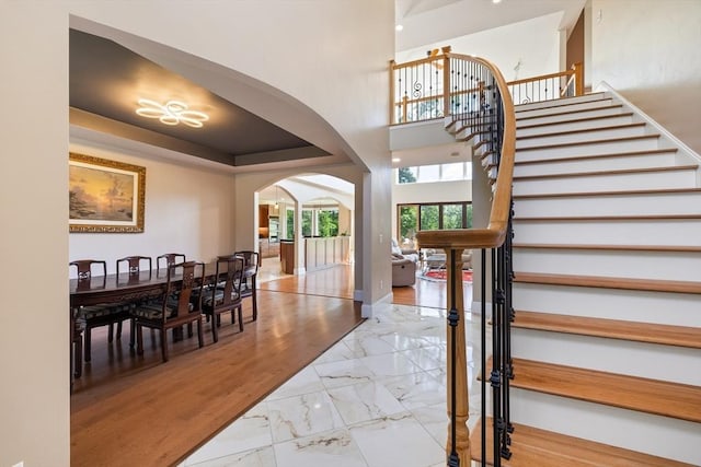 19 Hardscrabble Rd, Sterling, MA 01564 - stairs with arched walkways and marble look tile flooring
