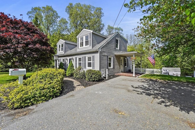 71 Mission Rd, Chelmsford, MA 01863 - view of front of house with a porch and fence