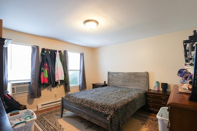 79-81 N Main St, Webster, MA 01570 - bedroom featuring a baseboard heating unit, wood finished floors, and cooling unit