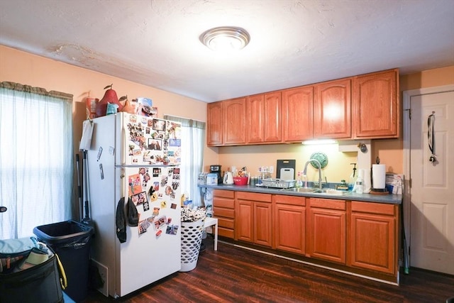 79-81 N Main St, Webster, MA 01570 - kitchen with freestanding refrigerator, dark wood-style flooring, and brown cabinetry