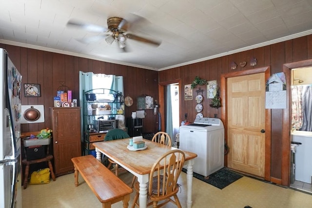 79-81 N Main St, Webster, MA 01570 - dining area with washer / dryer, light flooring, ornamental molding, a ceiling fan, and wood walls