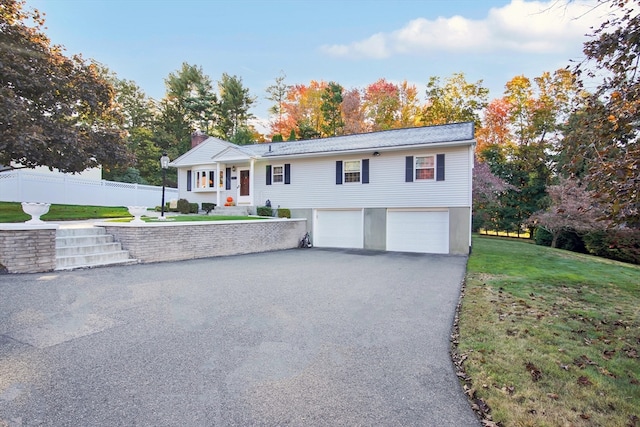 view of front facade with a garage and a front lawn