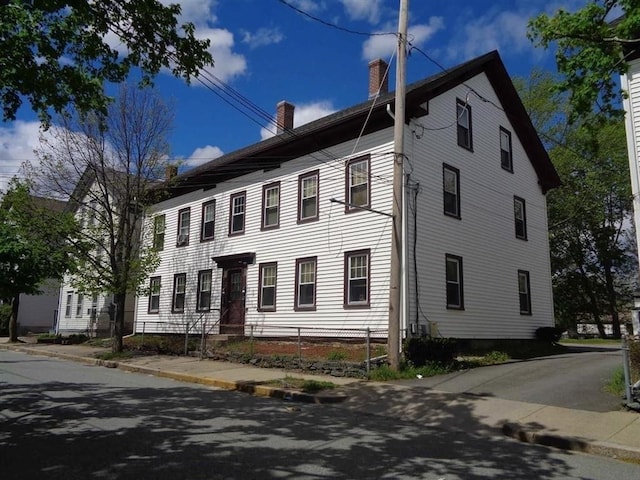 view of front of home with a chimney