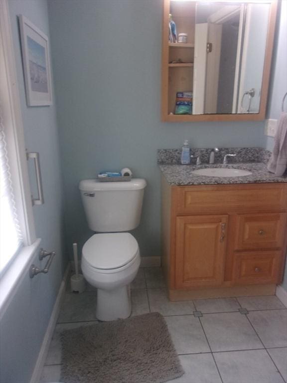 14 Mutton Ln, Weymouth, MA 02189 - bathroom with vanity, tile patterned floors, toilet, and baseboards