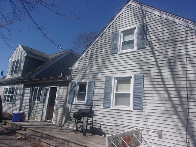 14 Mutton Ln, Weymouth, MA 02189 - rear view of property featuring a deck