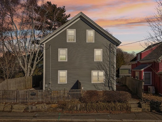 view of property exterior at dusk