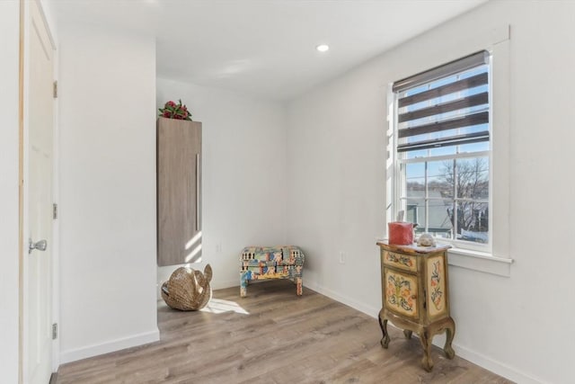 sitting room with light hardwood / wood-style flooring