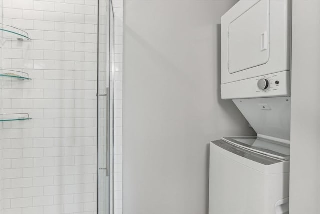 laundry area featuring stacked washing maching and dryer