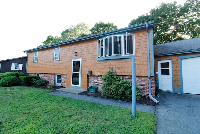 exterior space with a lawn and a garage