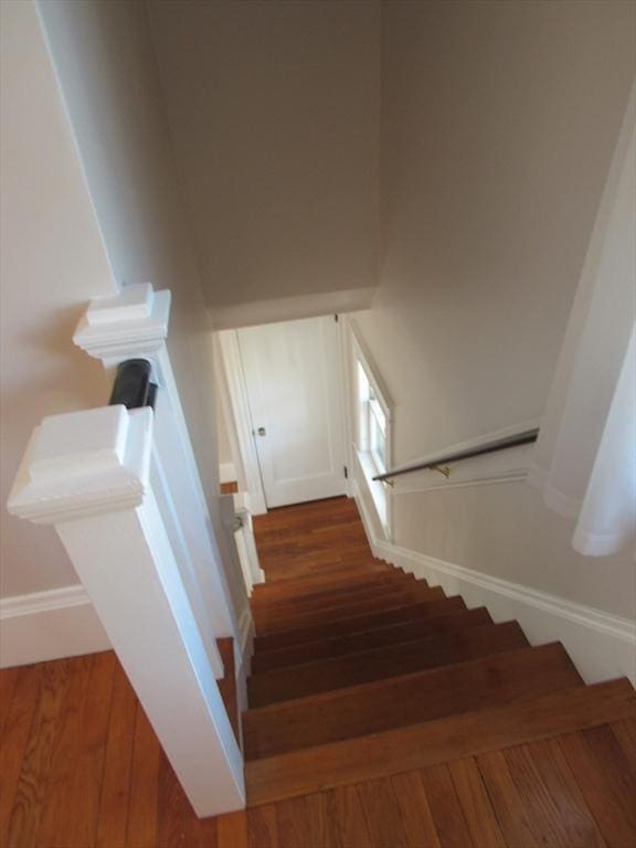 stairs with wood finished floors