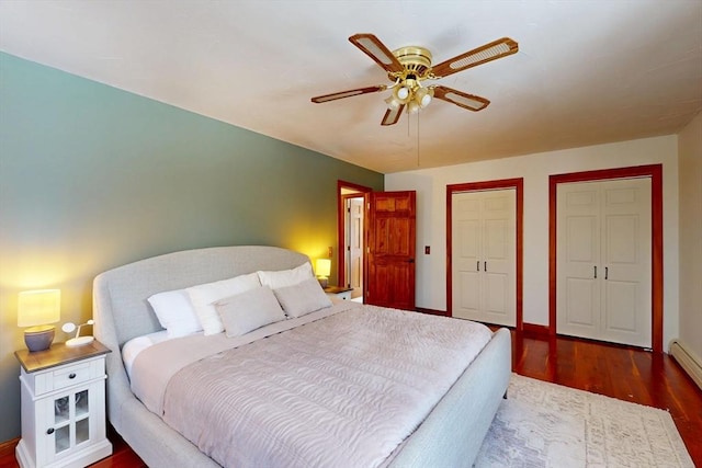 bedroom with ceiling fan, baseboards, and wood finished floors