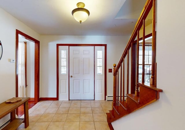 foyer entrance featuring stairs, a baseboard radiator, baseboards, and light tile patterned floors