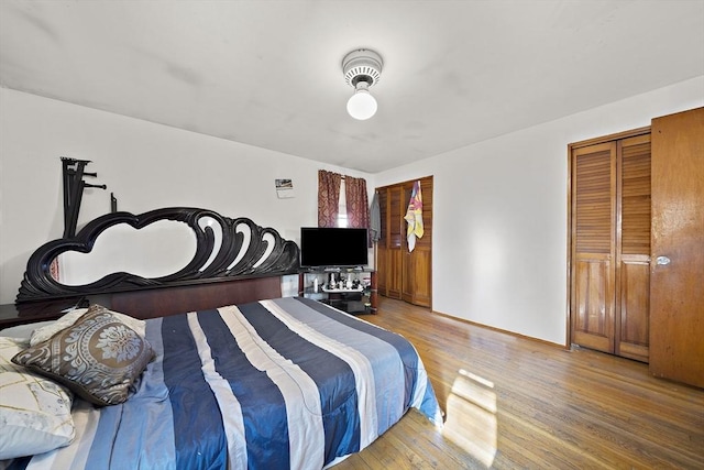 bedroom featuring hardwood / wood-style flooring