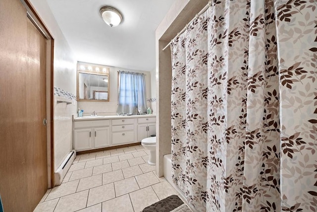 bathroom featuring baseboard heating, tile patterned flooring, vanity, toilet, and walk in shower