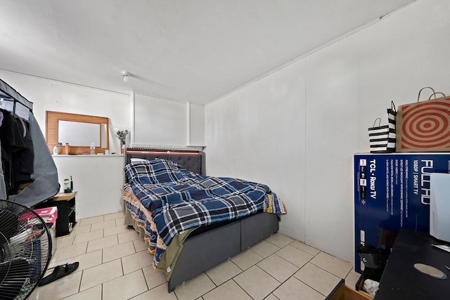 bedroom with light tile patterned floors