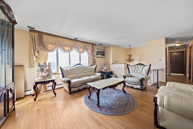 living room featuring light hardwood / wood-style floors and baseboard heating