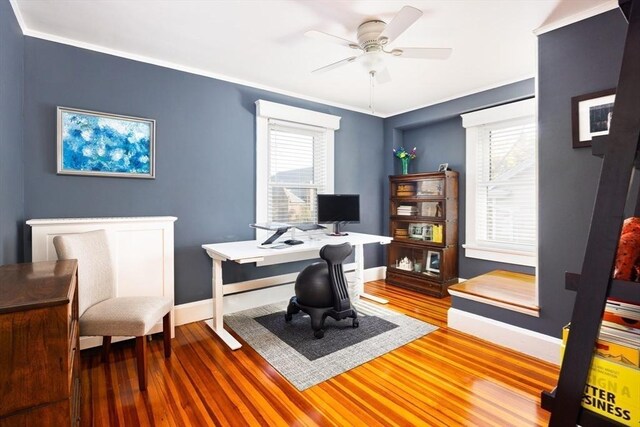 office with ornamental molding, ceiling fan, baseboards, and wood finished floors