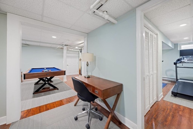 office with pool table, wood finished floors, a paneled ceiling, and baseboards